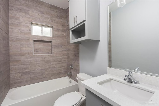 full bathroom with vanity, toilet, and tiled shower / bath