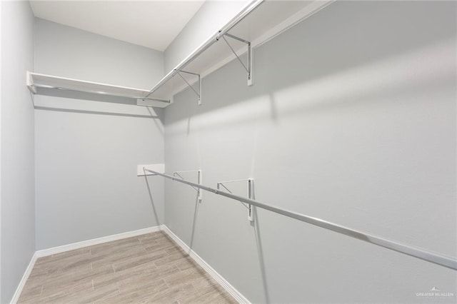 walk in closet featuring light wood-type flooring