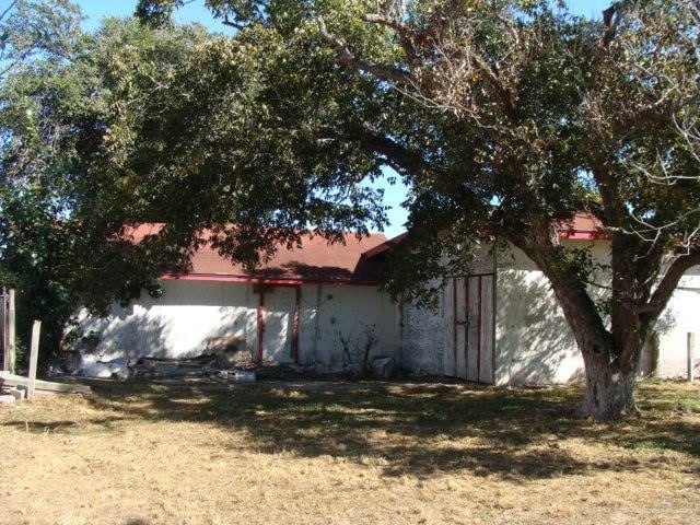 view of property exterior featuring a lawn