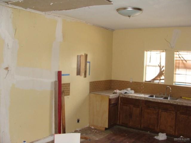 kitchen featuring sink and tasteful backsplash