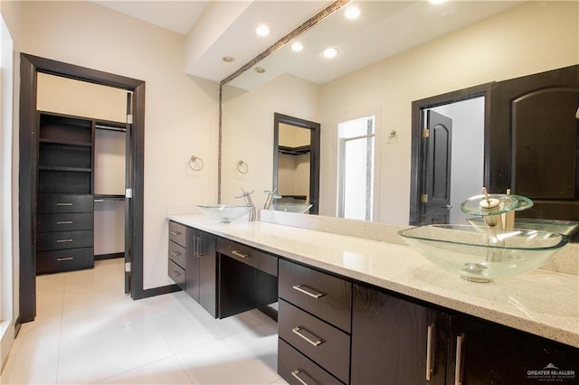 bathroom with tile patterned floors and vanity