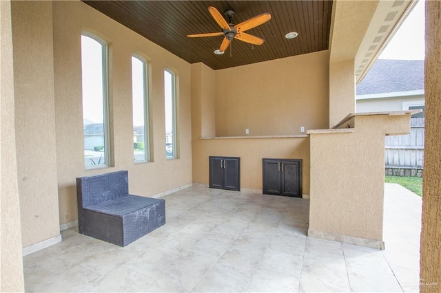 view of patio featuring ceiling fan