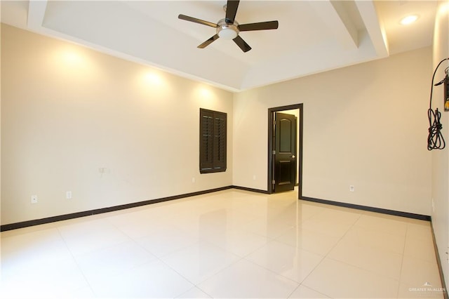 tiled spare room featuring ceiling fan