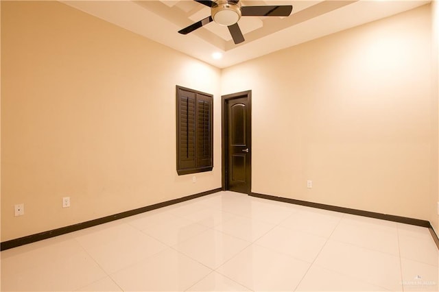 empty room with light tile patterned floors and ceiling fan