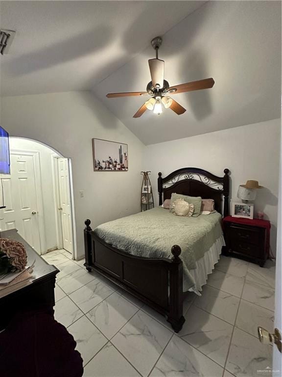 bedroom with ceiling fan and lofted ceiling