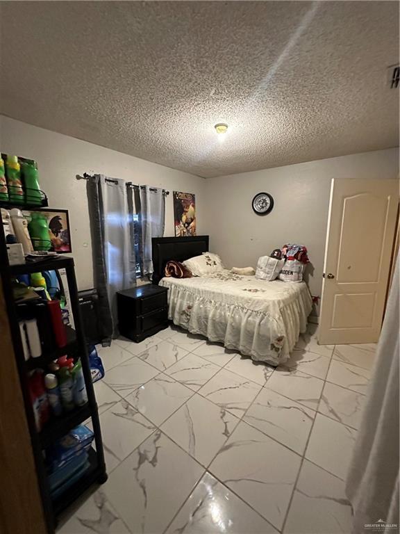 bedroom with a textured ceiling