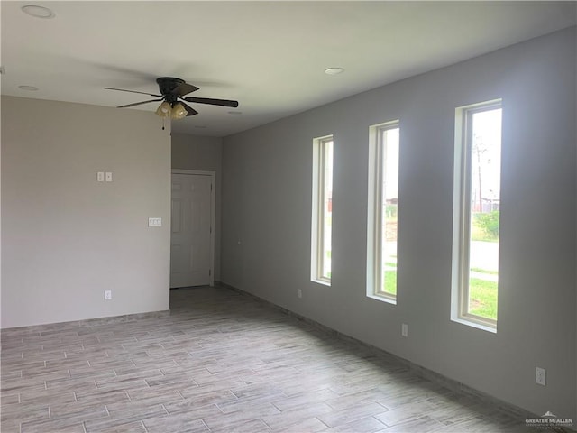 unfurnished room with ceiling fan