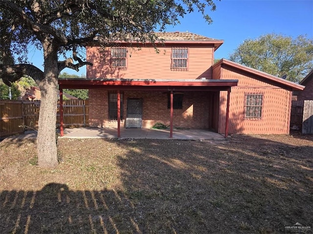 rear view of house featuring a patio