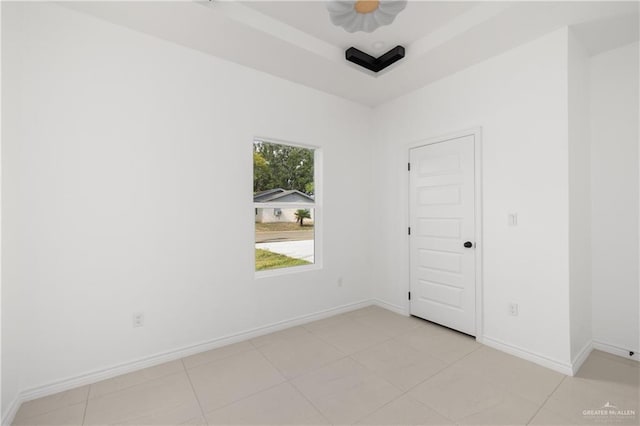 spare room with light tile patterned floors