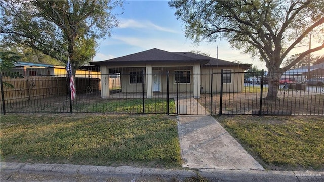 bungalow-style house with a front yard