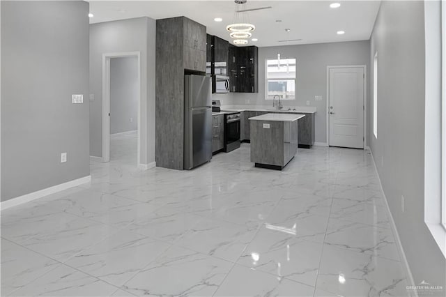 kitchen with a center island, recessed lighting, light countertops, appliances with stainless steel finishes, and modern cabinets