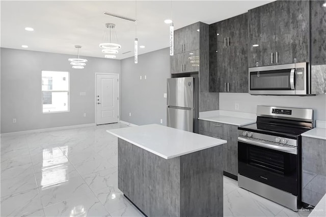 kitchen featuring stainless steel appliances, marble finish floor, and modern cabinets