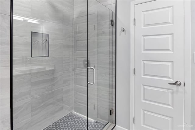 bathroom featuring a shower stall