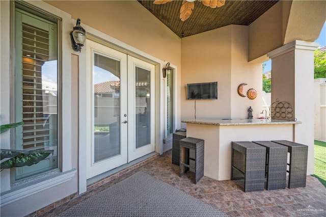 1901 Pecos St, Mission, TX 78572 - view of exterior entry with stucco siding, french doors, ceiling fan, and a patio area