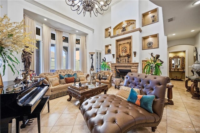 1901 Pecos St, Mission, TX 78572 - living area with light tile patterned flooring, a chandelier, a fireplace, a high ceiling, and recessed lighting