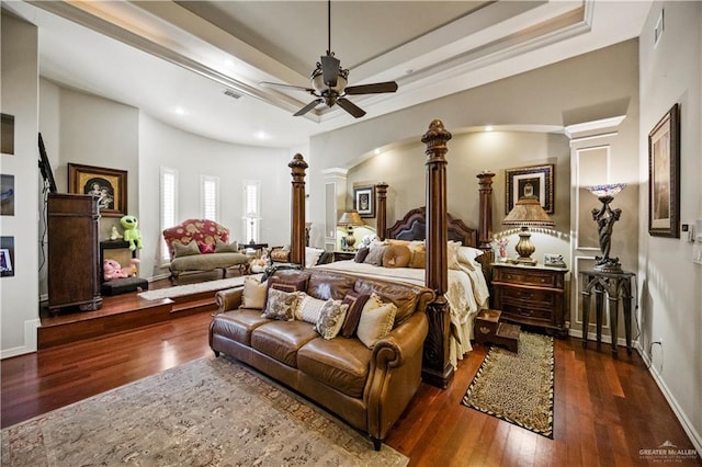 1901 Pecos St, Mission, TX 78572 - bedroom with ornate columns, wood-type flooring, arched walkways, a tray ceiling, and recessed lighting