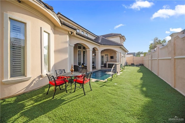1901 Pecos St, Mission, TX 78572 - fenced backyard with a patio area
