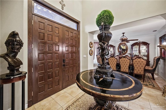 1901 Pecos St, Mission, TX 78572 - entrance foyer featuring a ceiling fan, light tile patterned floors, and ornamental molding