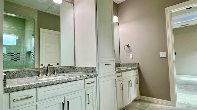 bathroom with vanity and walk in shower