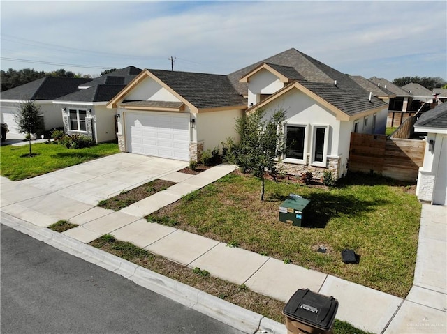 view of front of property featuring a garage and a front yard