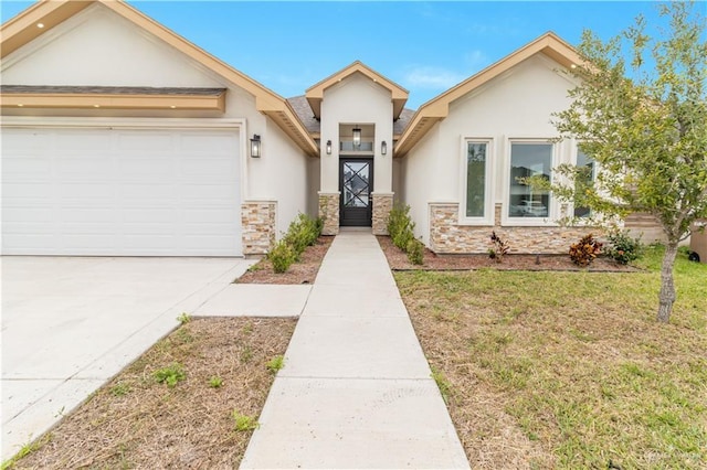 view of front facade with stone siding, a front yard, an attached garage, and stucco siding