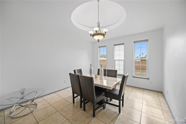 604 Hackberry Ave, Mission, TX 78572 - dining space featuring light tile patterned flooring, a chandelier, and baseboards