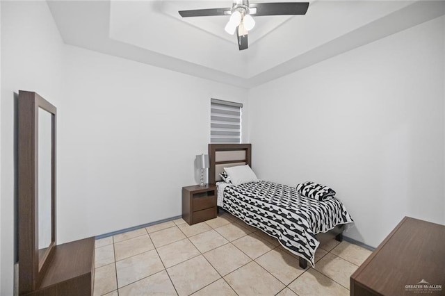 604 Hackberry Ave, Mission, TX 78572 - bedroom with a raised ceiling, light tile patterned floors, and ceiling fan