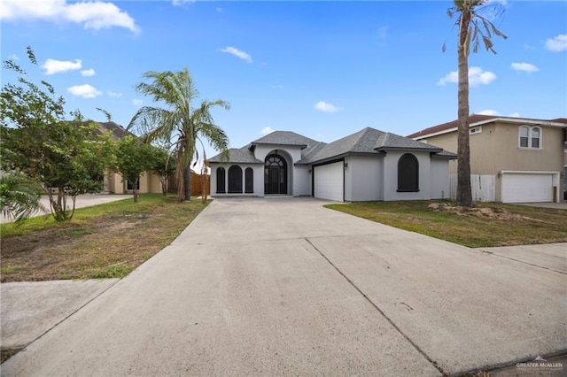 604 Hackberry Ave, Mission, TX 78572 - view of front of home featuring driveway and a garage