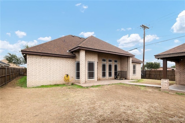 back of property featuring a patio