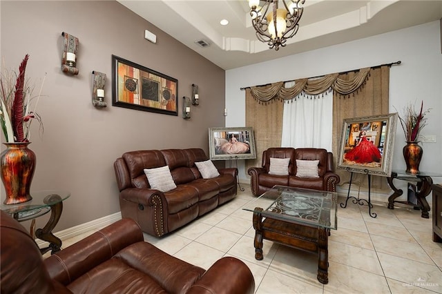 tiled living room with a raised ceiling and a chandelier