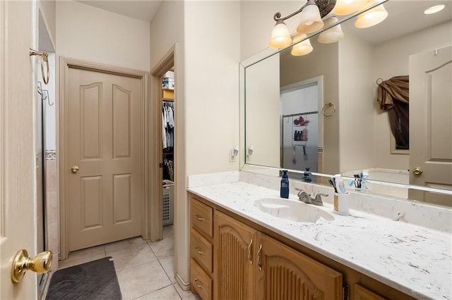 bathroom with tile patterned flooring and vanity