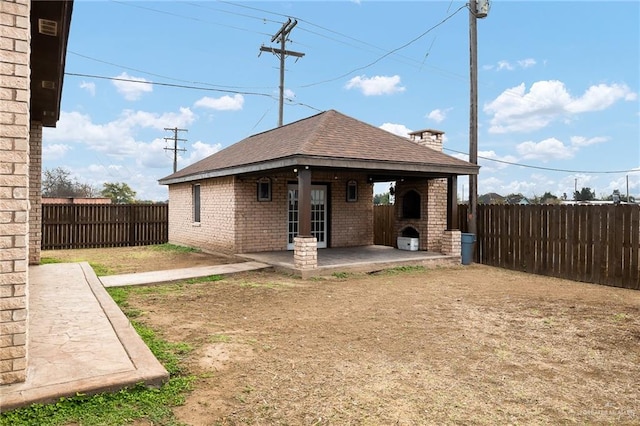 rear view of property featuring a patio area