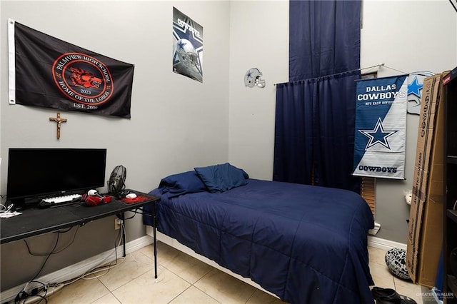 bedroom featuring light tile patterned floors