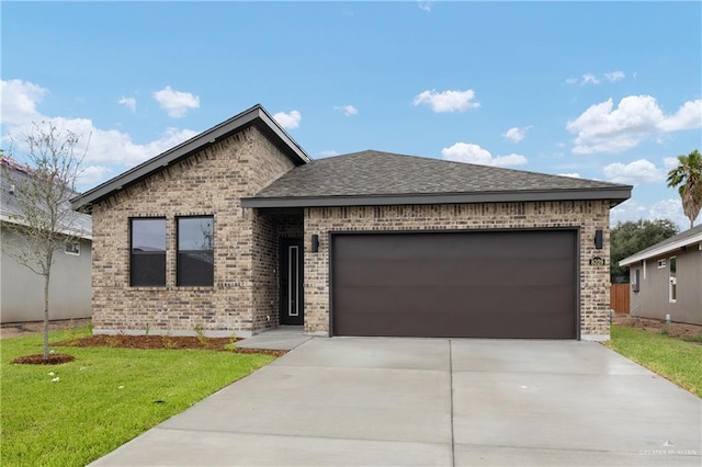 8329 N 35th St, Mcallen, TX 78504 - view of front of house with brick siding, a garage, concrete driveway, a front yard, and roof with shingles