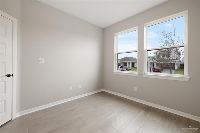 8329 N 35th St, Mcallen, TX 78504 - spare room with baseboards and light wood-style floors