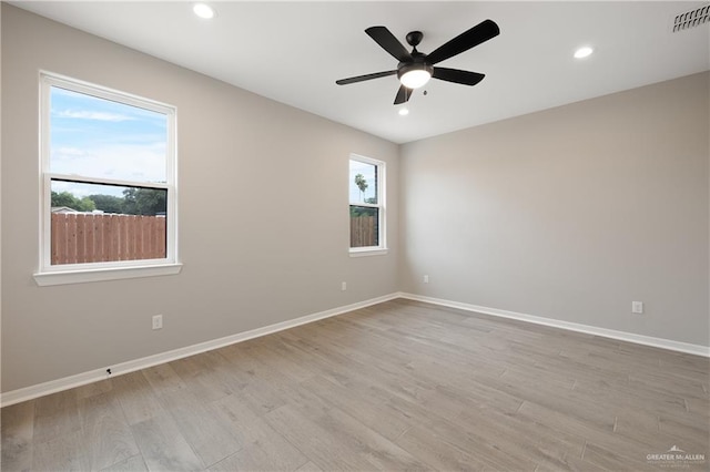 8329 N 35th St, Mcallen, TX 78504 - spare room featuring wood finished floors, a ceiling fan, and recessed lighting