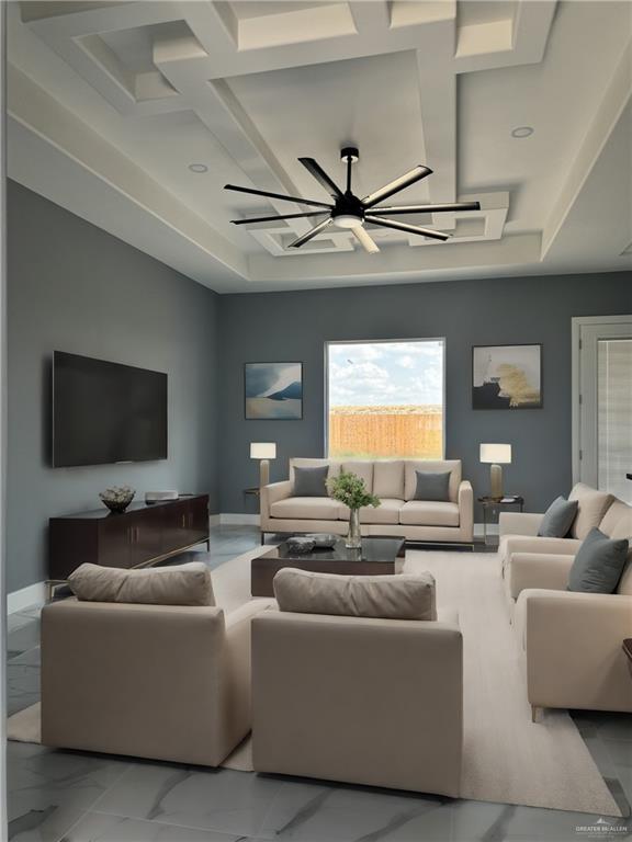 living room featuring ceiling fan and coffered ceiling