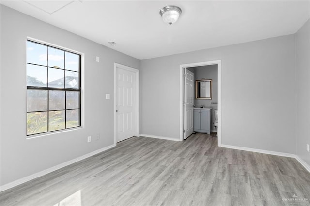 unfurnished room with light hardwood / wood-style floors