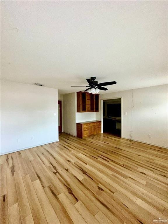 unfurnished living room featuring light wood-type flooring