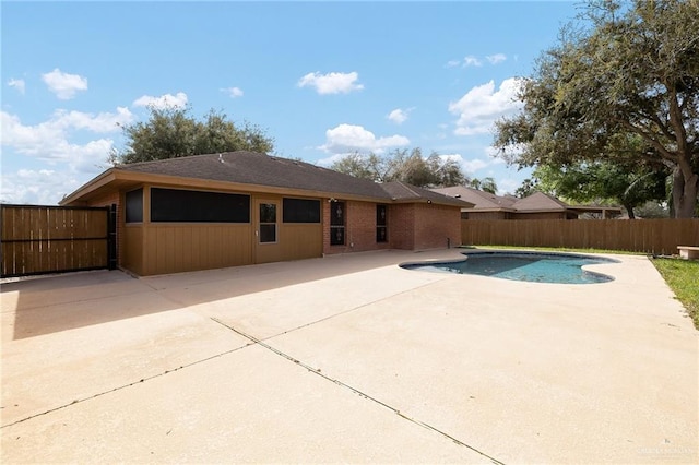 view of swimming pool with a patio area, a fenced backyard, and a fenced in pool