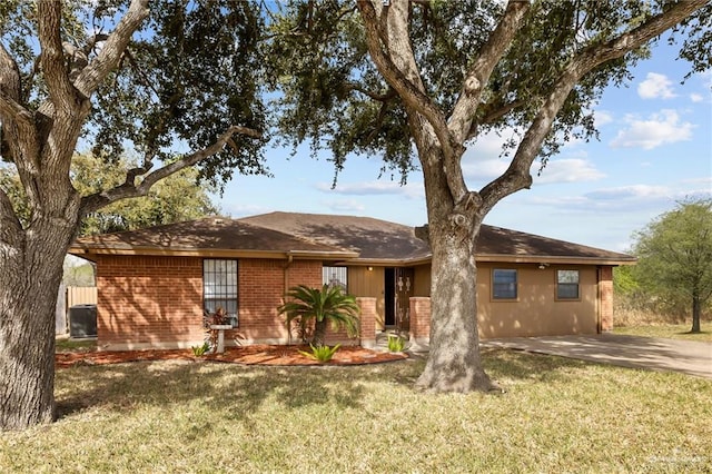 ranch-style house featuring driveway, a front lawn, and brick siding