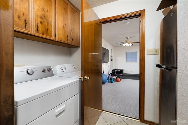 laundry area with light colored carpet, cabinet space, a ceiling fan, light tile patterned flooring, and separate washer and dryer