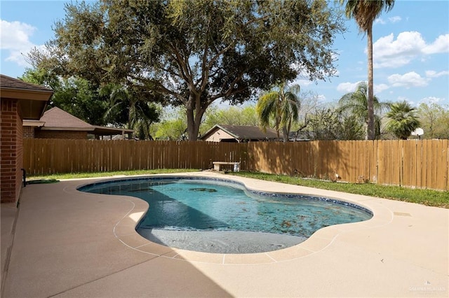 view of swimming pool featuring a patio area, a fenced backyard, and a fenced in pool