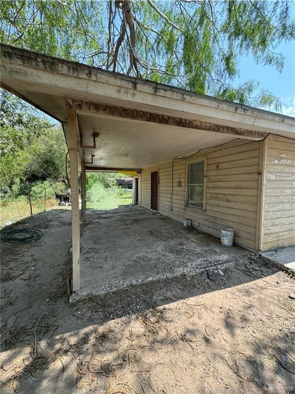 exterior space with a carport