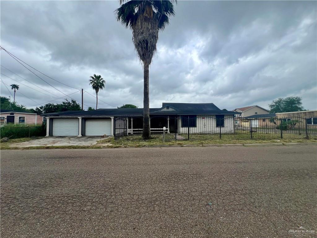 601 S 23rd St, Donna, TX 78537 - single story home featuring fence, an attached garage, and driveway