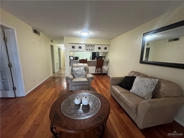 living room featuring dark hardwood / wood-style floors