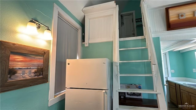 kitchen with white refrigerator and sink