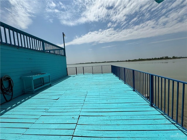 wooden terrace with a water view