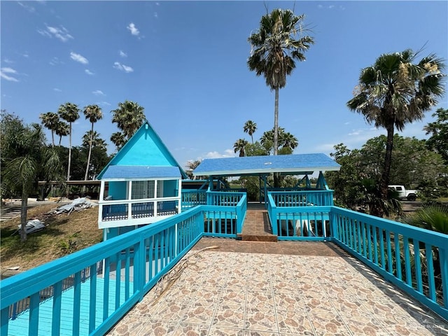 rear view of house featuring a swimming pool