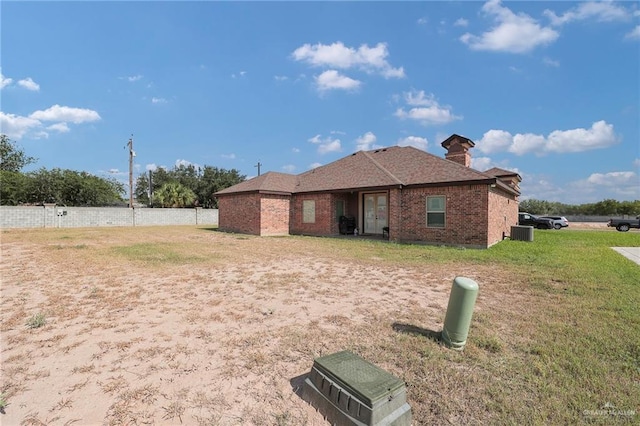 2000 Shelby St, Mission, TX 78572 - back of house featuring brick siding and central AC unit